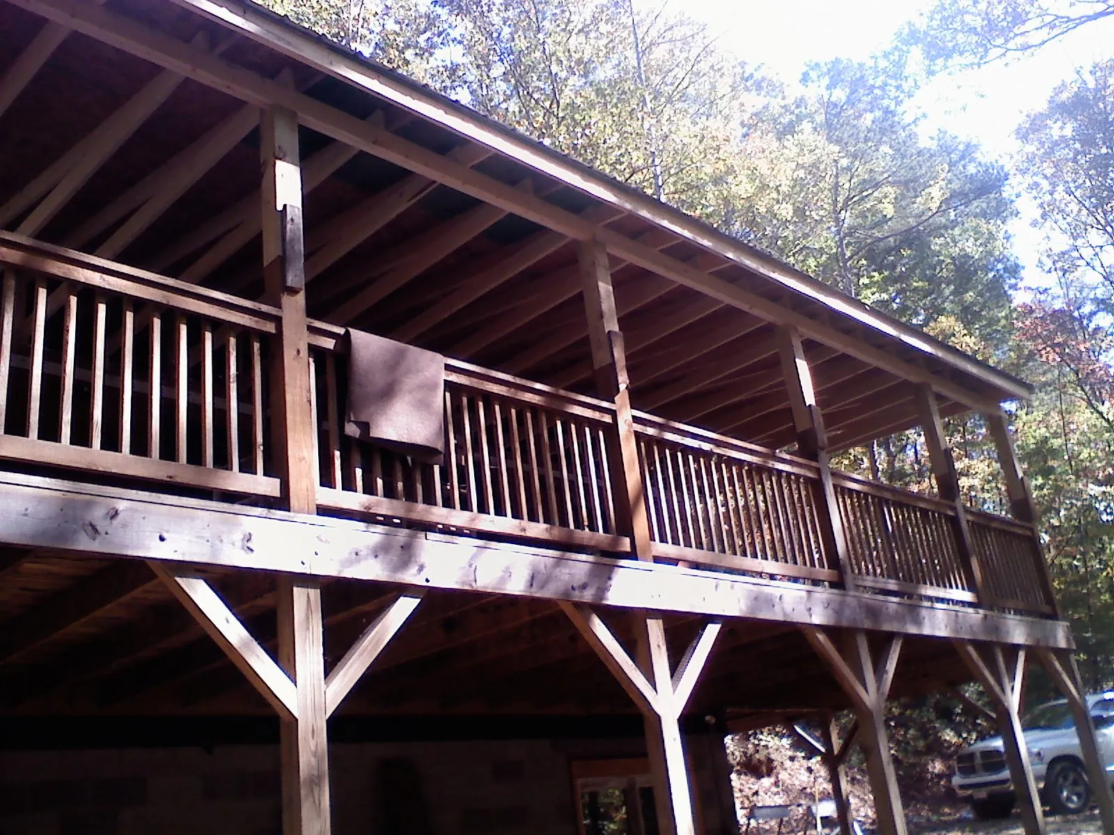 Timber framing under a new elevated porch and deck — Roof Leak Repair in Dallas Center by Roofing Brothers